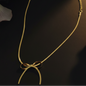 Golden Love: Ribbon Bow Pendant Gold Necklace